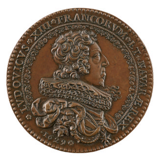 Bronze portrait medal of Louis XIII, hair short and curled, with a lovelock on his left shoulde…