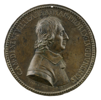 Bronze medal of a man in profile to the right wearing a soft collar with tassels over a jerkin