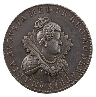 Silver portrait medal of Marie de’ Medici, crowned, hair braided into a knot, wearing a high an…