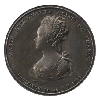 Lead medal of a woman in profile to the right with her hair decorated with feathers and wearing…