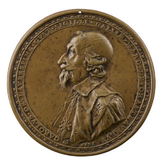Bronze medal of a man in profile to the left