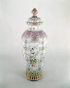 Very Tall Covered  porcelain Jar with blue, white, and violet decoration.