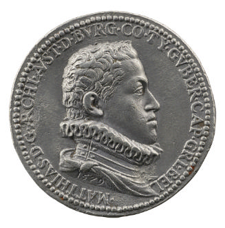 Lead medal of a man in profile to the right wearing armor, mantle, and ruff