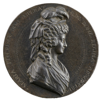Iron medal of woman in profile to the right wearing shawl and hat