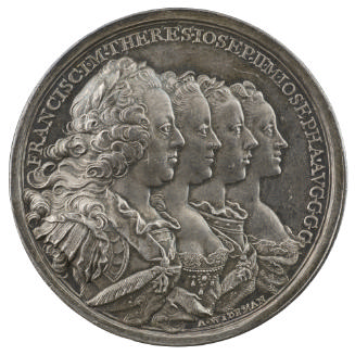 Silver medal of two men and two women in profile to the right