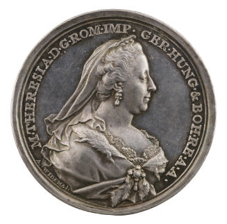 Silver medal of a woman wearing a crown, veil, earrings, and dress with a fur collar collected …
