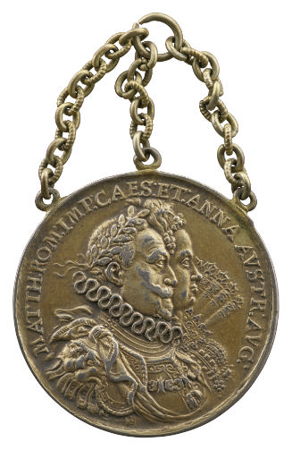Gilt-silver medal of a man and woman in profile to the right