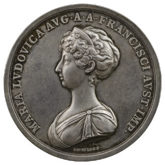 Silver medal of a woman in profile to the left wearing a diadem and tunic dress