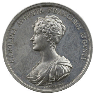 Pewter medal of a woman in profile to the left wearing diadem, lace dress, and shawl