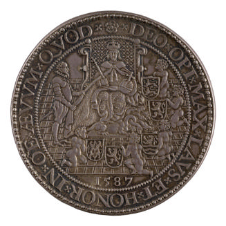 Silver medal depicting Queen Elizabeth holding the scepter and the orb and seated on her throne…