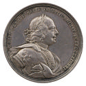 Silver medal of a man crowned with laurel, wearing a harness with inlaid plastron and decorated…