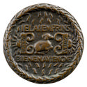 Bronze medal of a ram with curled horns with symmetrical symbols on either side and an inscript…