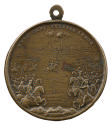 Bronze medal depicting, in the central middle ground, a soldier on horseback, with a hat outstr…