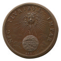 Bronze medal depicting the sun, with a face and curly hair, surrounded by rays, shining upon a …