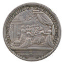 Silver medal of a queen sitting beneath a canopy in a neoclassical palatial setting with a corn…