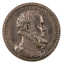 Silver portrait medal of the Duke of Alba.  He is shown in profile on his right side.  He wears…