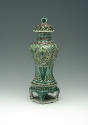 Porcelain jar with legs and lid with green, blue, and yellow pattern decoration