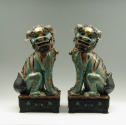 Pair of green porcelain lions, viewed from the front