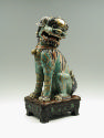 Side view of green porcelain lion