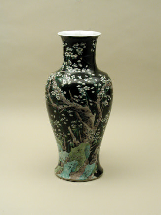 Black ground porcelain vase with branches and white flowers