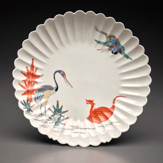 Fulted dish with two herons and an orange dragon