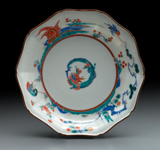 ten-sided dish with dragons in a landscape