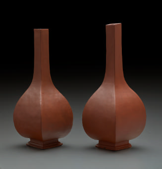 two four-sided brown bottles