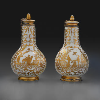 two bottles with elaborate gold decoration