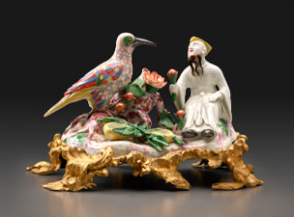 male figure with bird on a gilt-bronze mount