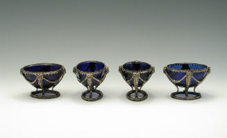 Photograph of four blue bowls with silver mounts