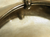 Close-up photograph of engraving on silver bowl