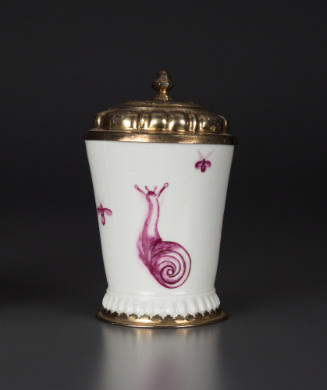 White cup with a pink painted snail, silver gilt cover and foot.