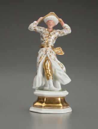 White porcelain figurine of a male with gilt decoration