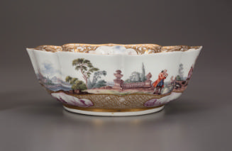 Side view of a bowl with a painted scene and gilt decoration