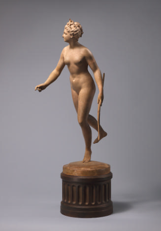 A tinted plaster sculpture of Diana.  She stands on the ball of her left foot, her right foot i…