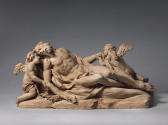 Terracotta sculpture of a pietà scene with two mourning pitti.  The figure of Jesus is the cent…