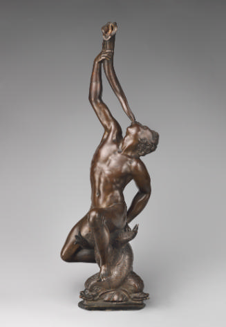 Bronze sculpture of a male figure blowing a trumpet raised up with his right hand