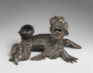 A bronze sculpture of a sea-monster