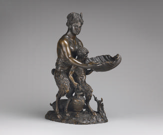 Bronze sculpture of a satyr mother with a satyr child.  The mother figure is holding a large se…