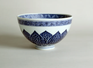Blue and white porcelain bowl with vegetal motif.