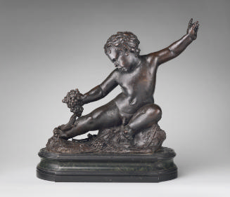 Bronze sculpture of a seated infant faun.  His left arm is stretched out behind him and his rig…