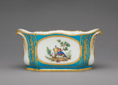 Alternate view of porcelain oval dish in blue, white, and gold with birds