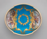 Alternate view of porcelain water basin in blue, white, and gold with genre scenes