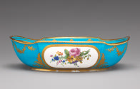 Basin in blue, white, and gold with images of flowers