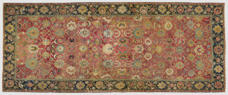 Red Rectangular Persian rug with floral design and a blue border
