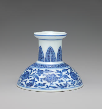 Blue and white hard-paste porcelain low candlestick with blue foliage decoration