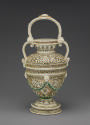 Back view of painted porcelain ewer with spout at the center