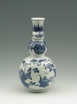 Blue and white porcelain vase with floral and object decoration.