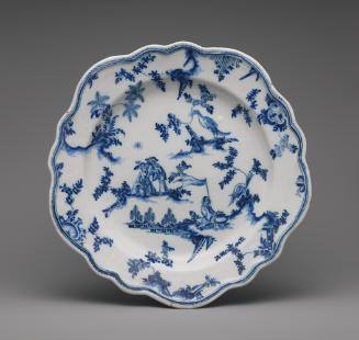 Pentagonal plate with figures and floral decoration in blue
