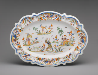 Oval platter with dancing figure and floral decoration in color